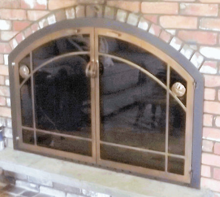 Weston Arch Window-Pane  Black frame finish with vice bi fold doors, center handles, and sandollar appliques. standard smoke glass. Comes with gate mesh spark screens.